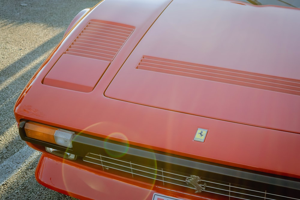 a red sports car parked in a parking lot