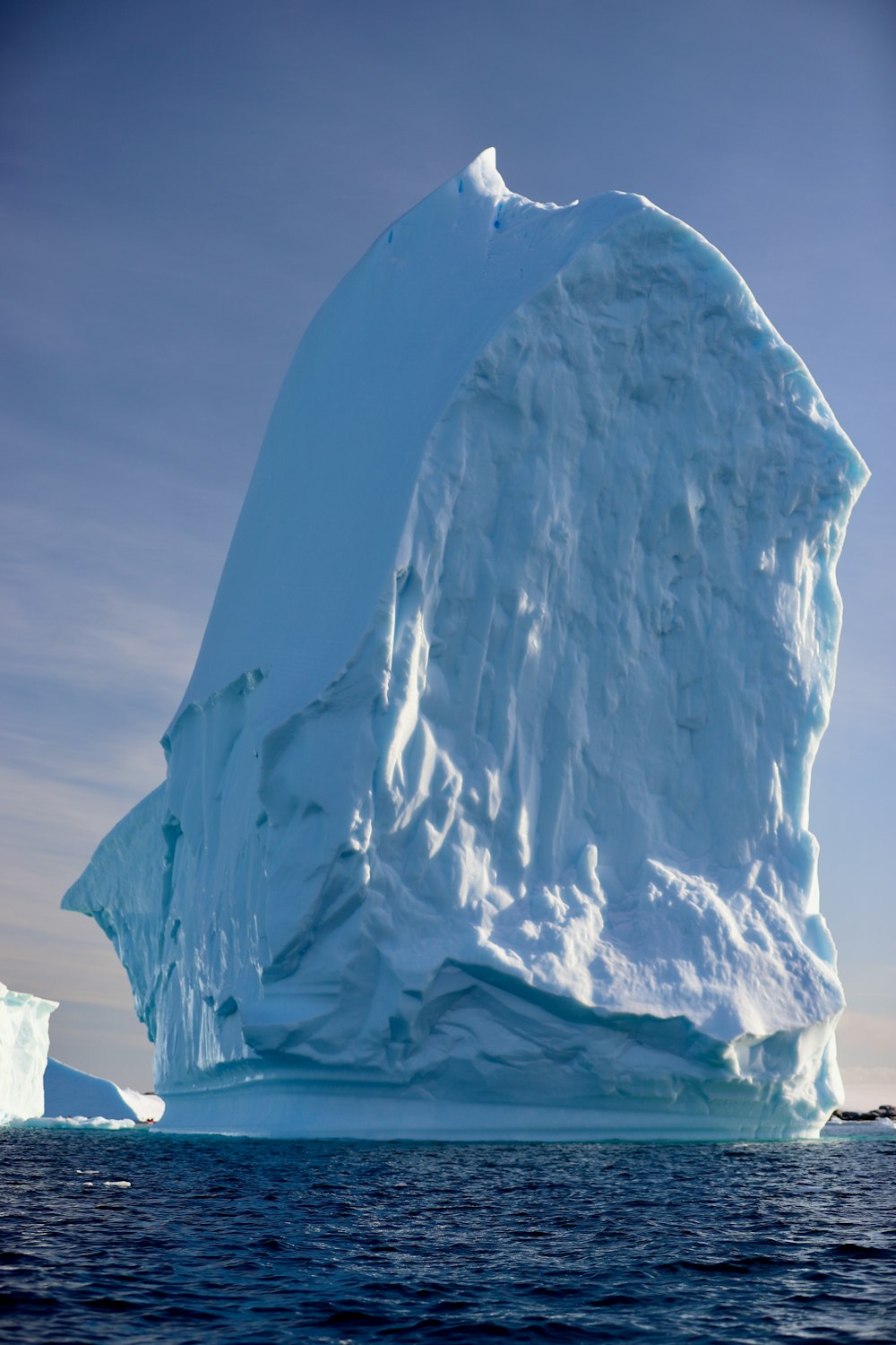 a large iceberg floating in the ocean