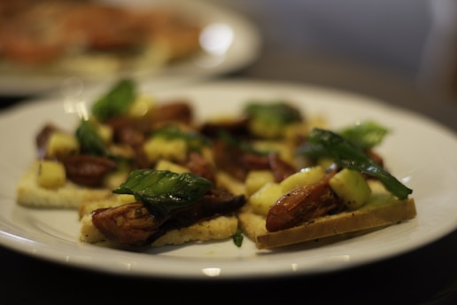 a white plate topped with food on top of a table
