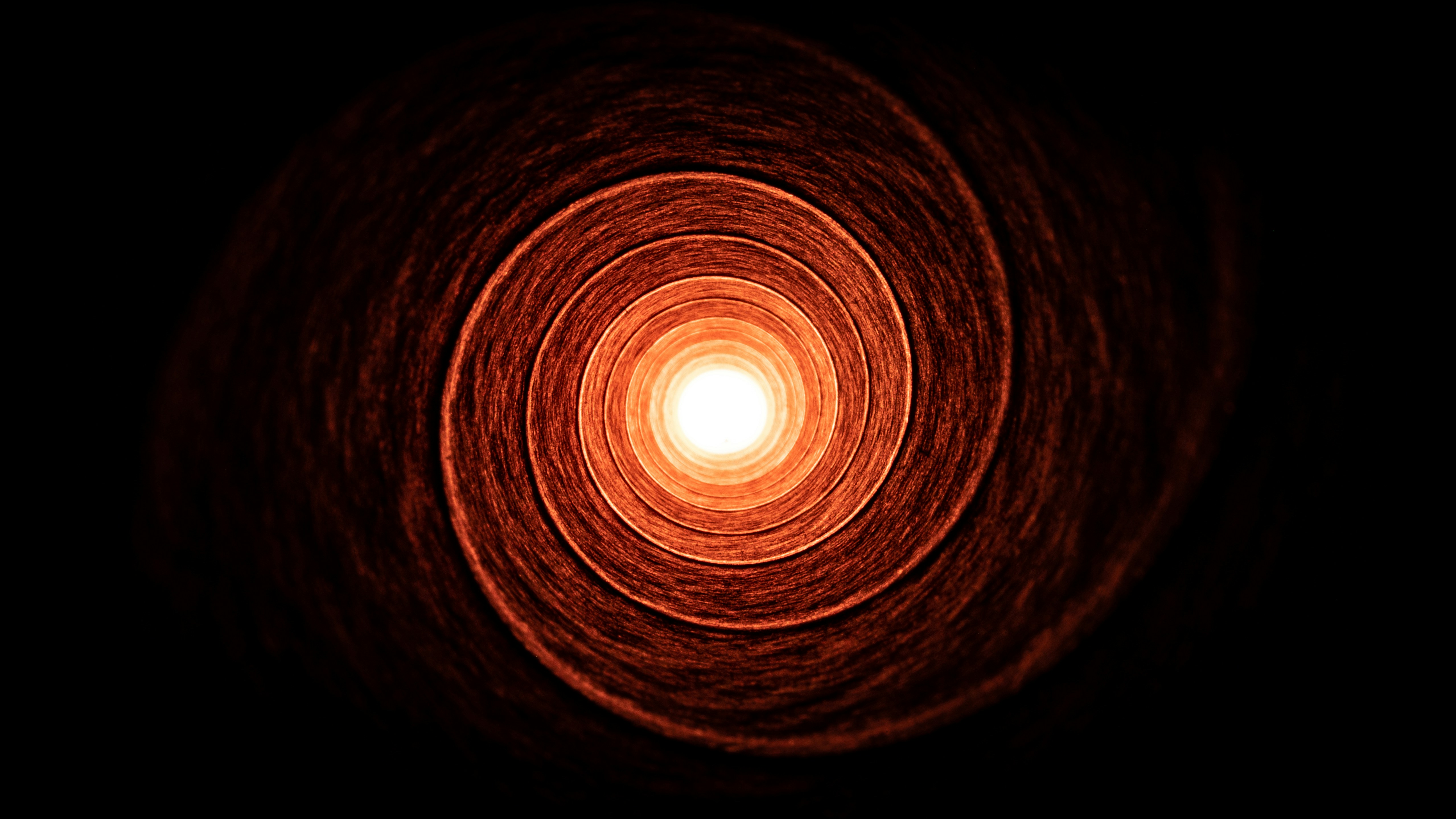 a light in the middle of a dark room