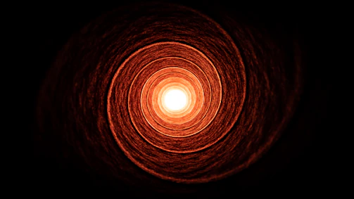 a light in the middle of a dark room