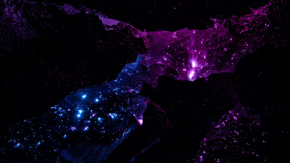 a purple and blue space filled with stars