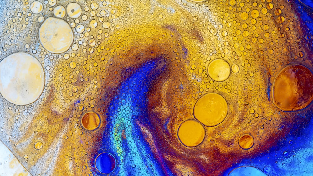 an abstract painting with yellow and blue colors