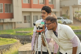 a couple of men standing next to each other