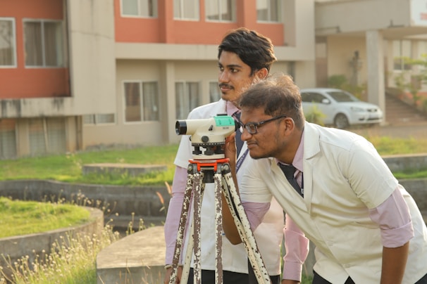 a couple of men standing next to each other