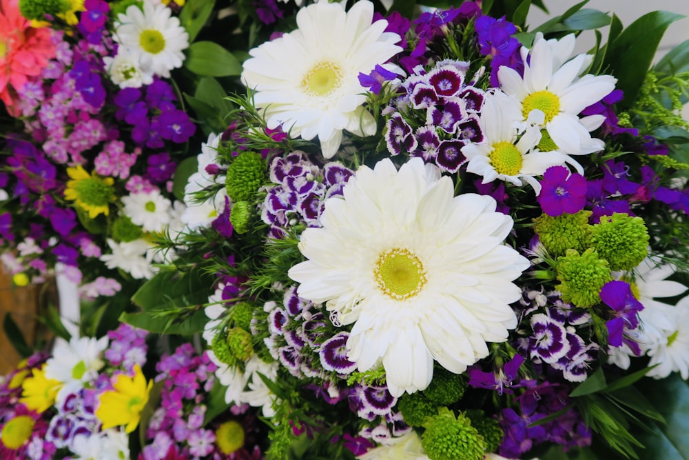 a bunch of flowers that are sitting on a table