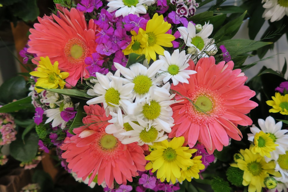 a bunch of flowers that are in a vase