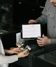 a man and a woman standing in front of a counter