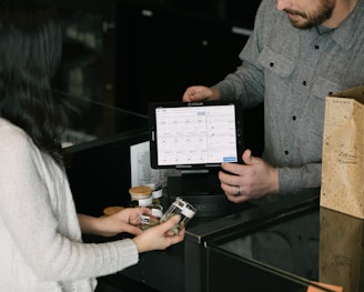 a man and a woman standing in front of a counter