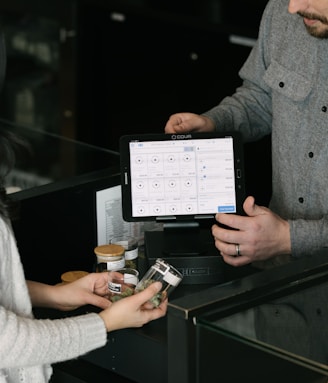 a man and a woman standing in front of a counter