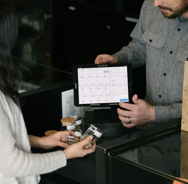 a man and a woman standing in front of a counter