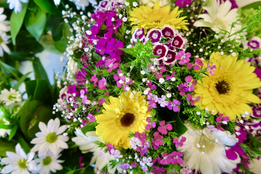 a bunch of flowers that are sitting on a table