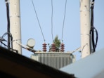 a view of some power lines and a tower