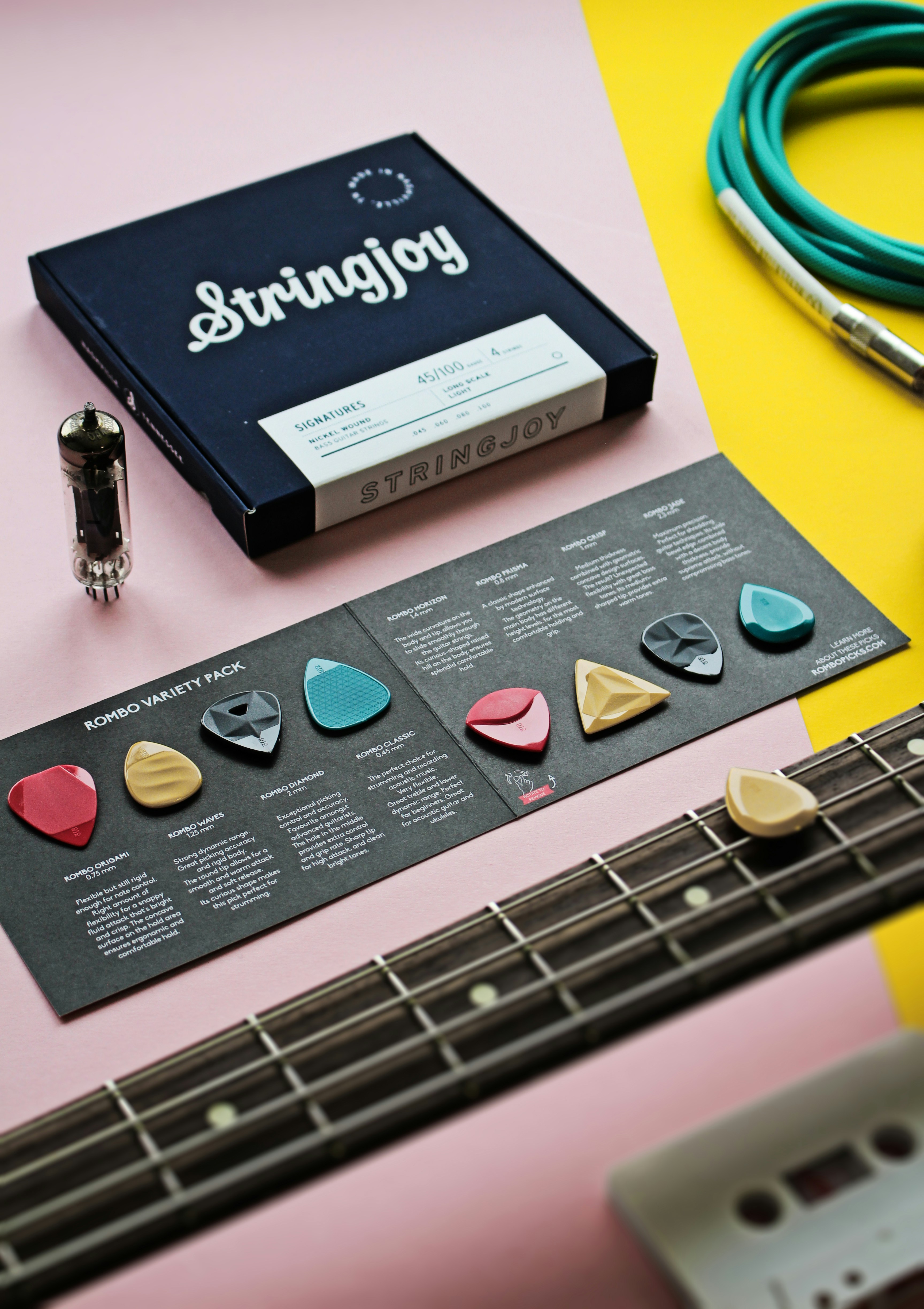 a guitar and a book on a table