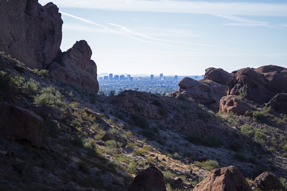 a view of the city from the top of a mountain