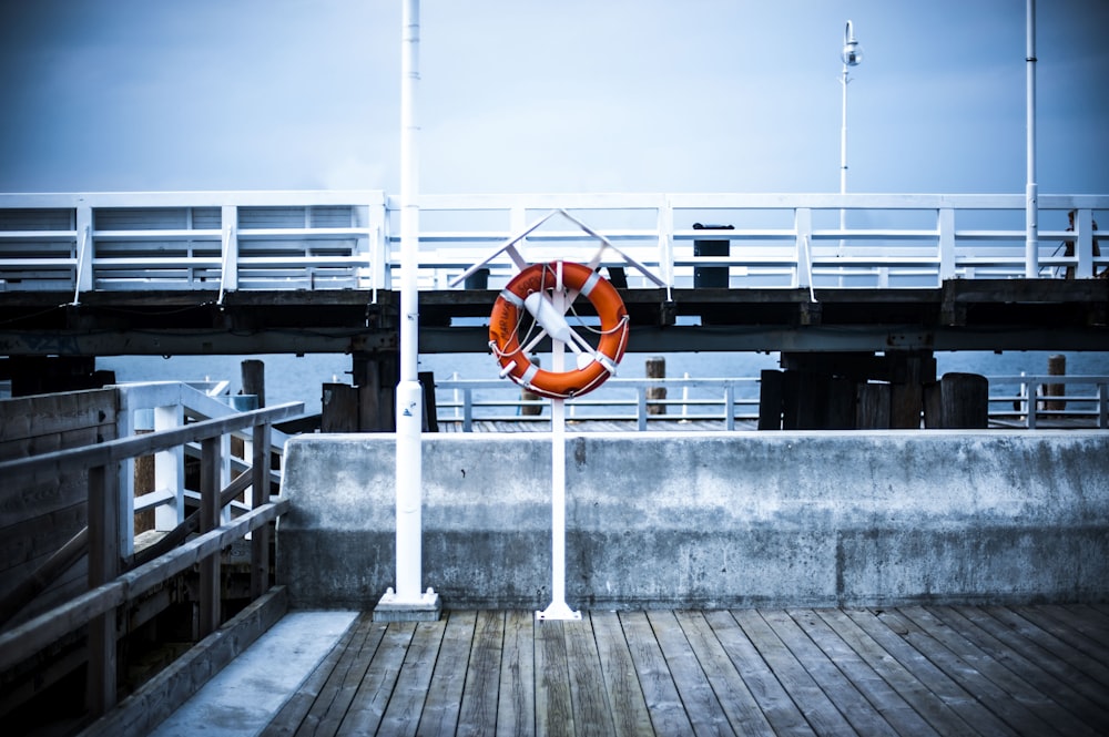 a life preserver hanging on a metal pole