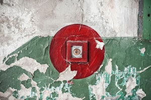 Polish fire alarm button covered by a Molly-guard