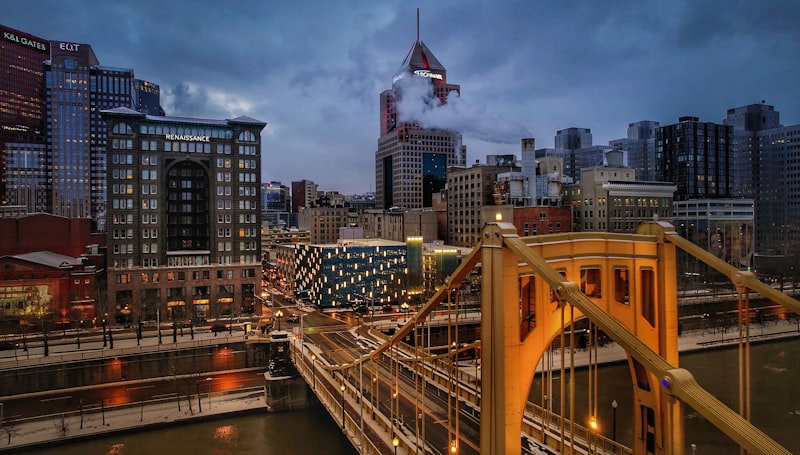 Pittsburgh skyline and yellow bridge at dusk — Western Pennsylvania