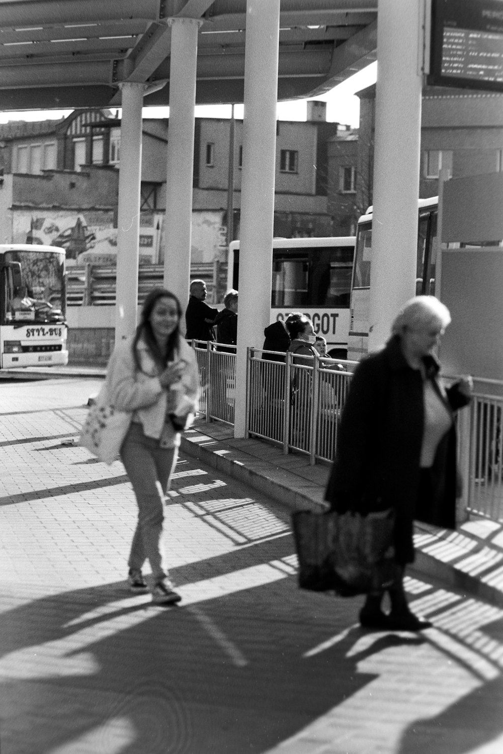 a black and white photo of a woman and a man