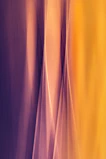Abstract golden light rays blending into soft violet hues