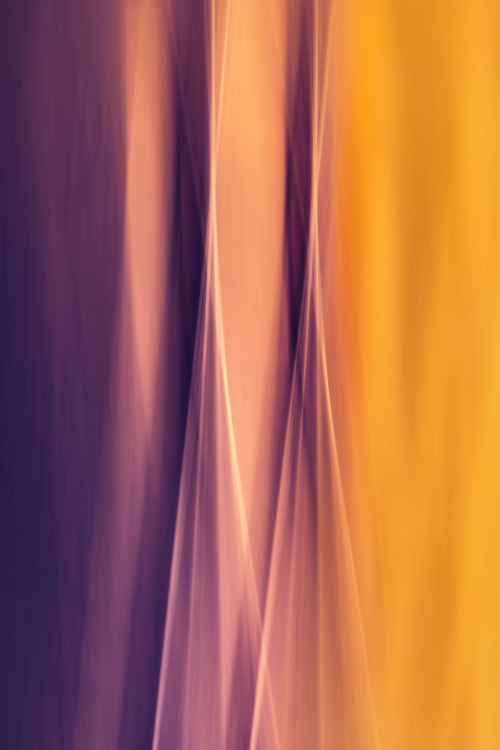 a blurry image of a yellow and purple background