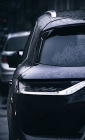 a car parked on the side of the road covered in snow