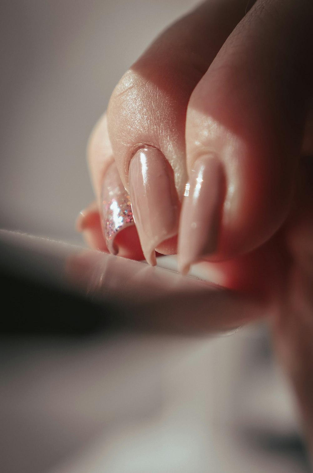 a woman's hand with a manicure on it