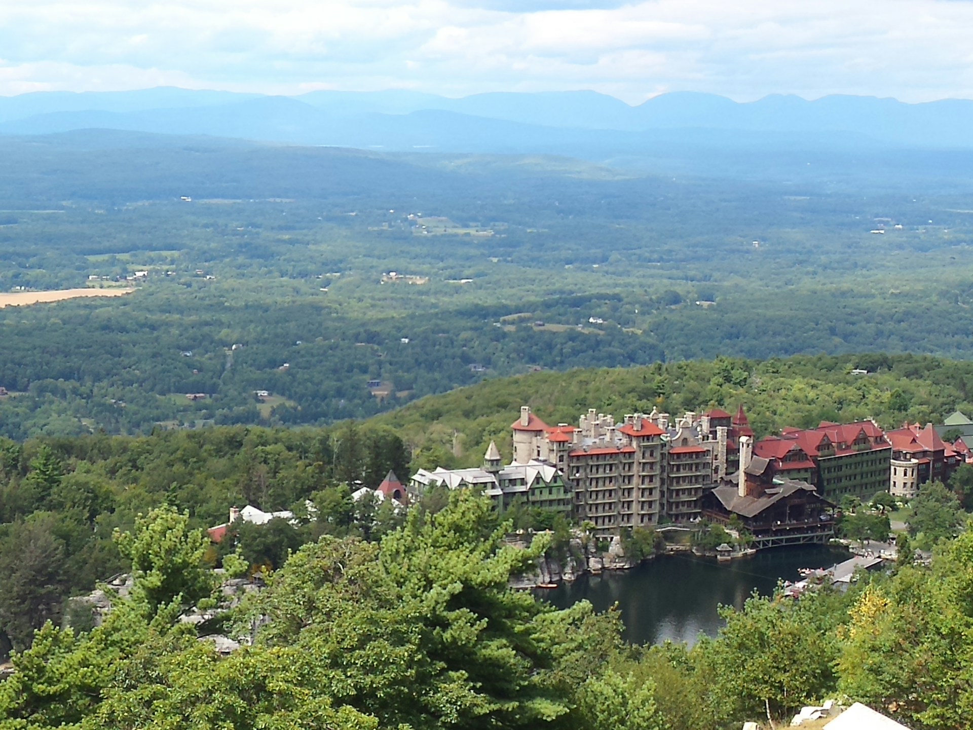 woman wearing yellow long-sleeved dress under white clouds and blue sky during daytime
