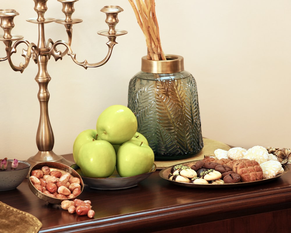 a table topped with plates of food and a candelabra