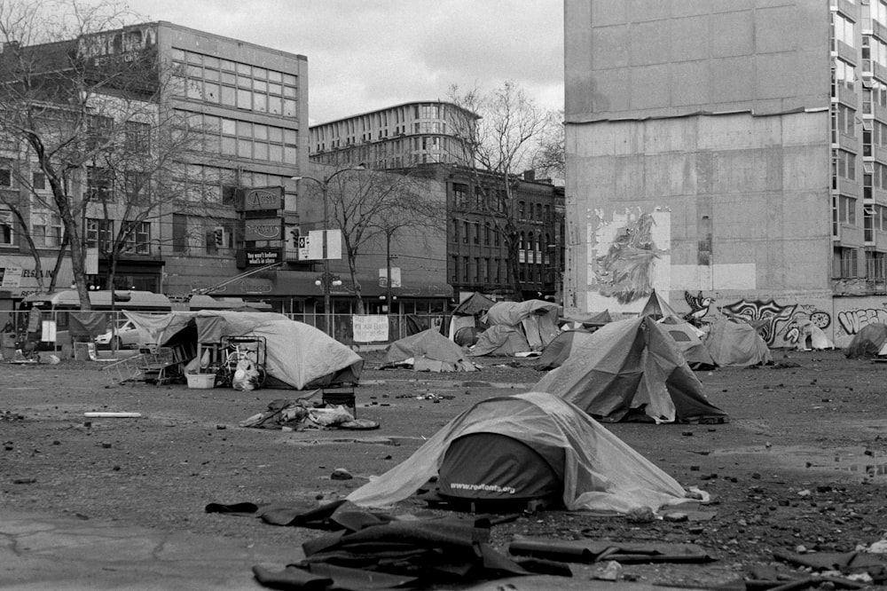 a black and white photo of a homeless camp site