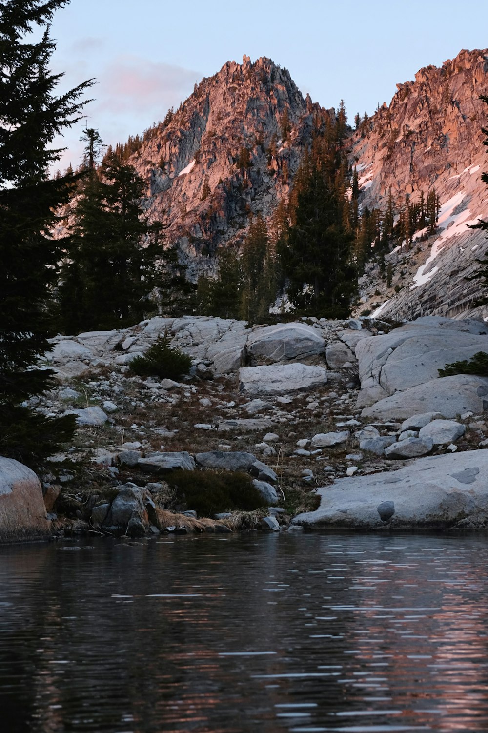 a mountain with a body of water in front of it