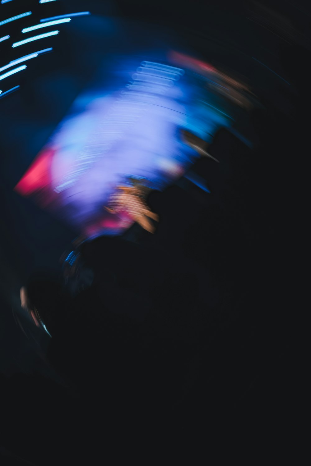 a blurry photo of a person riding a skateboard