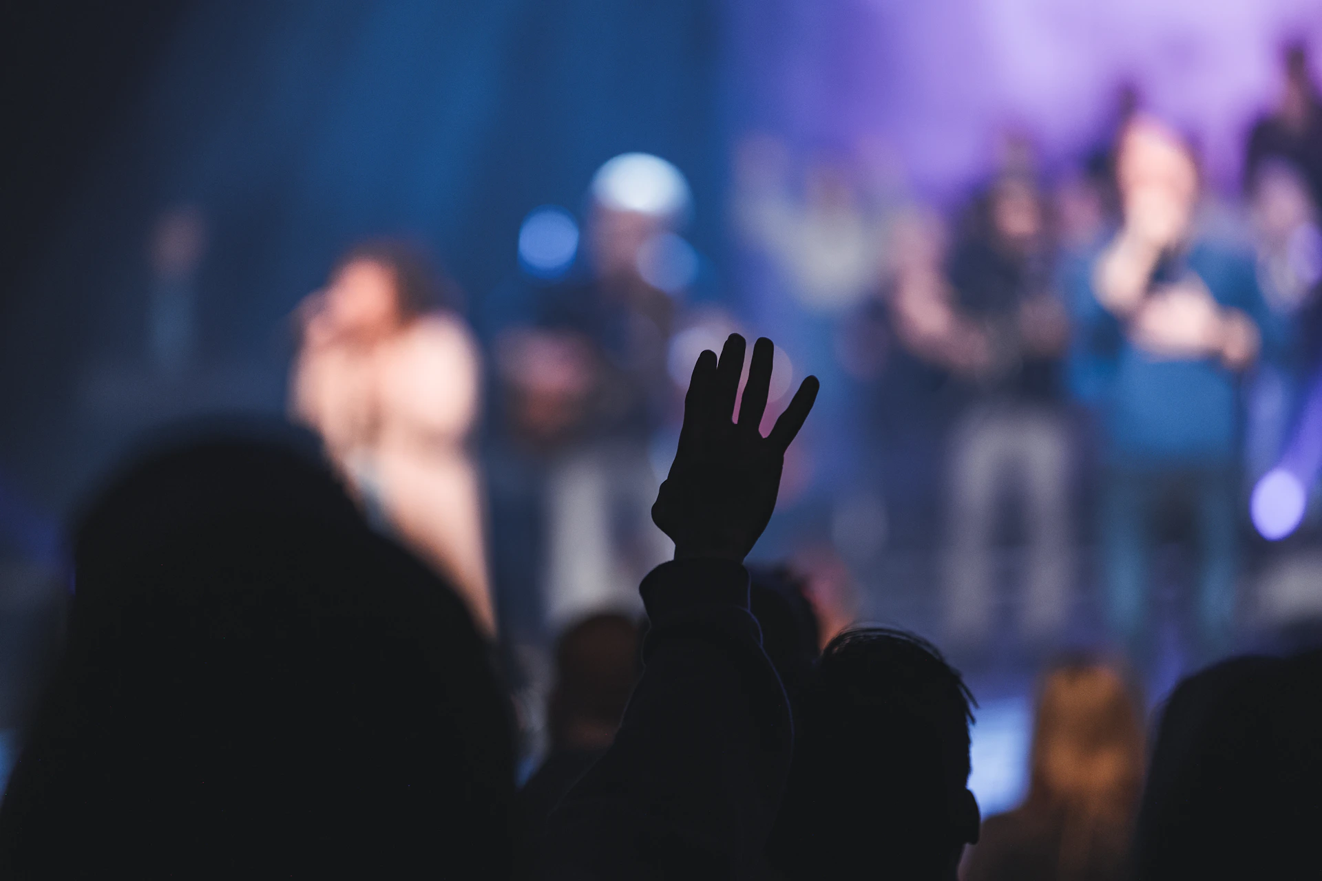 a group of people standing on top of a stage