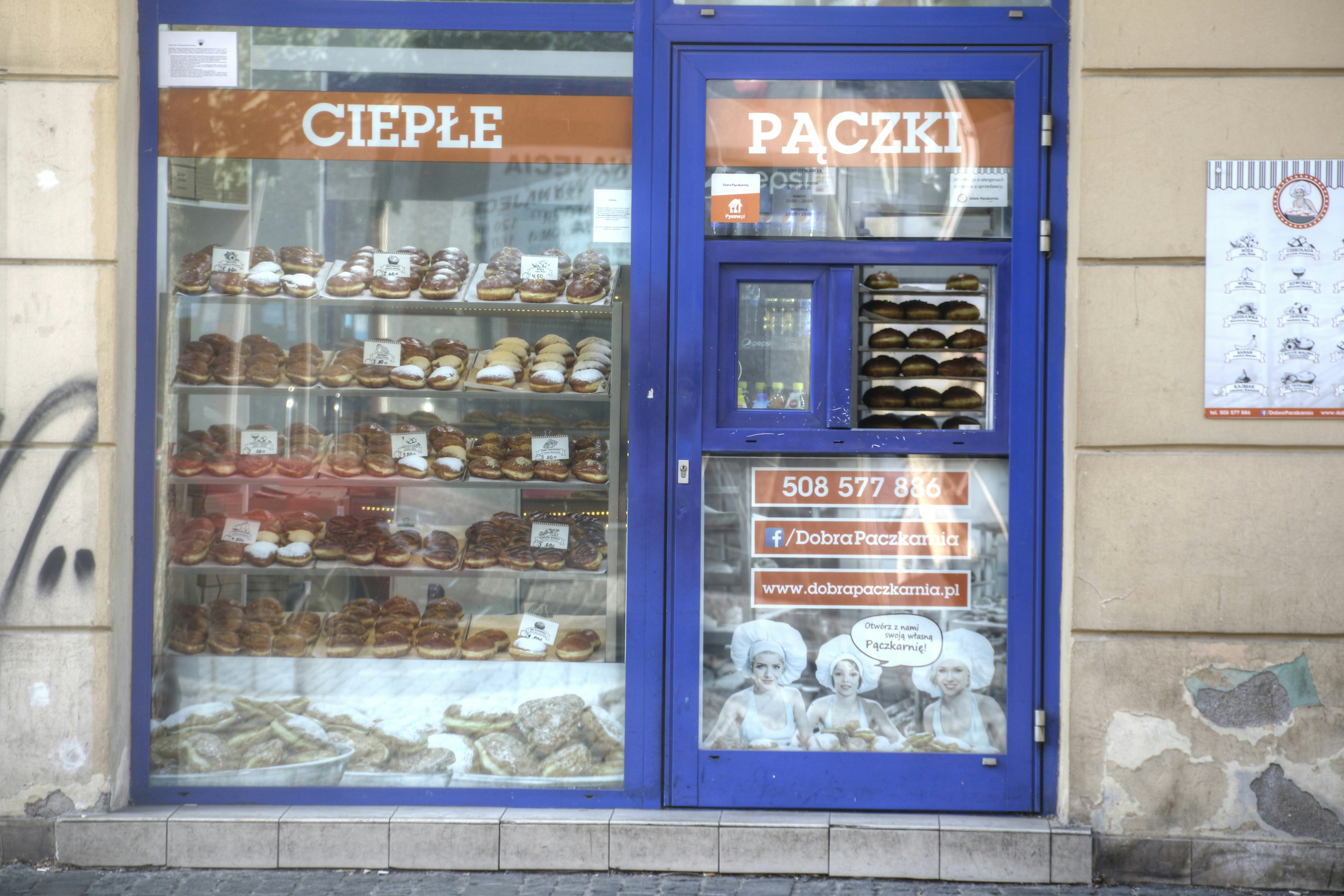 a store front with a display of pastries