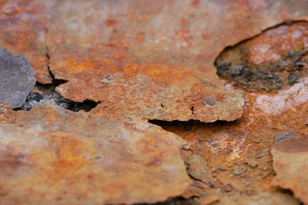 a close up of a rusted metal surface