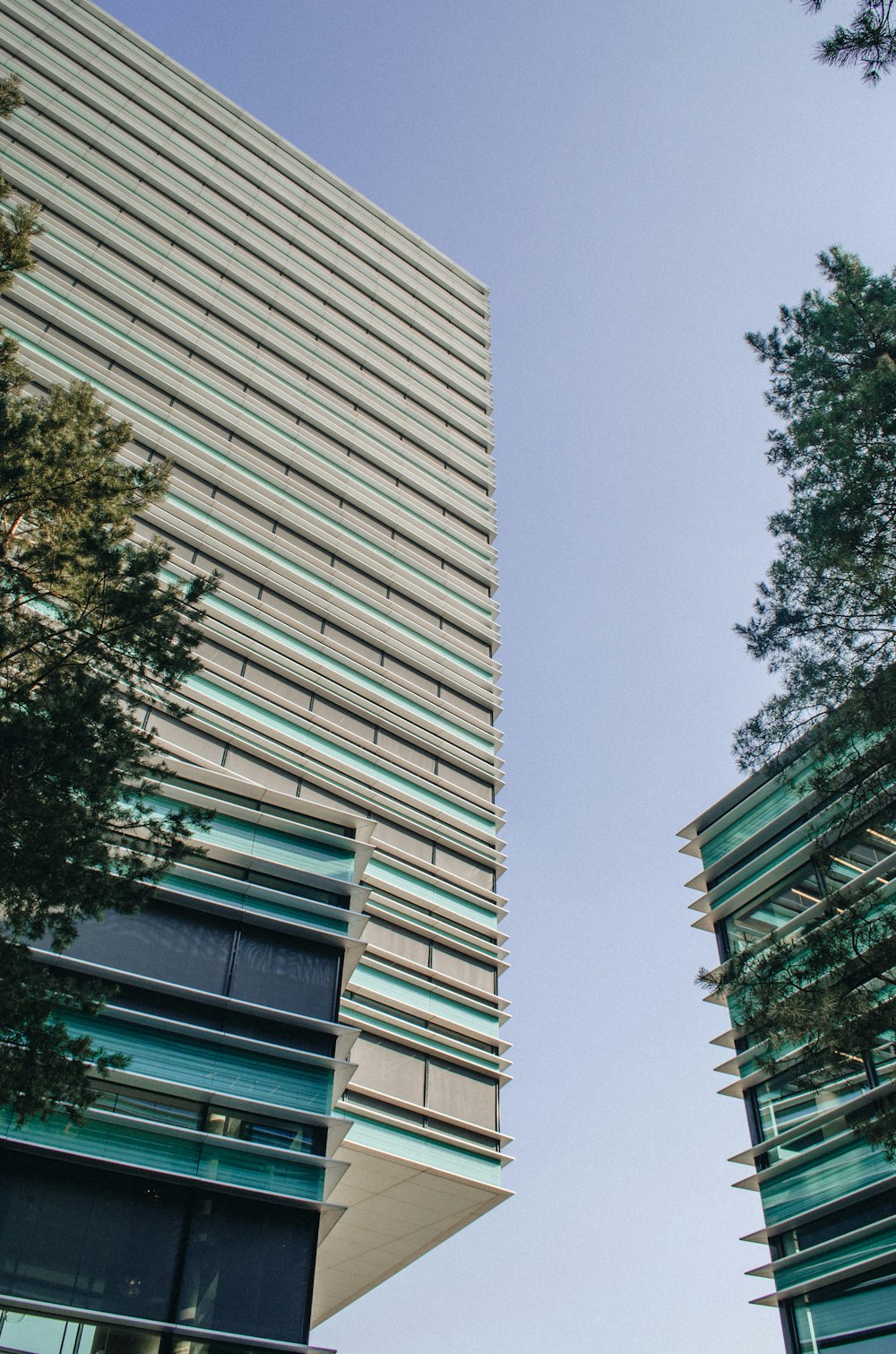 a couple of tall buildings sitting next to each other