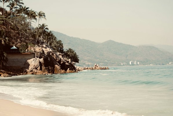 A view of a beach with a mountain in the background — Puerto Vallarta, Mexico