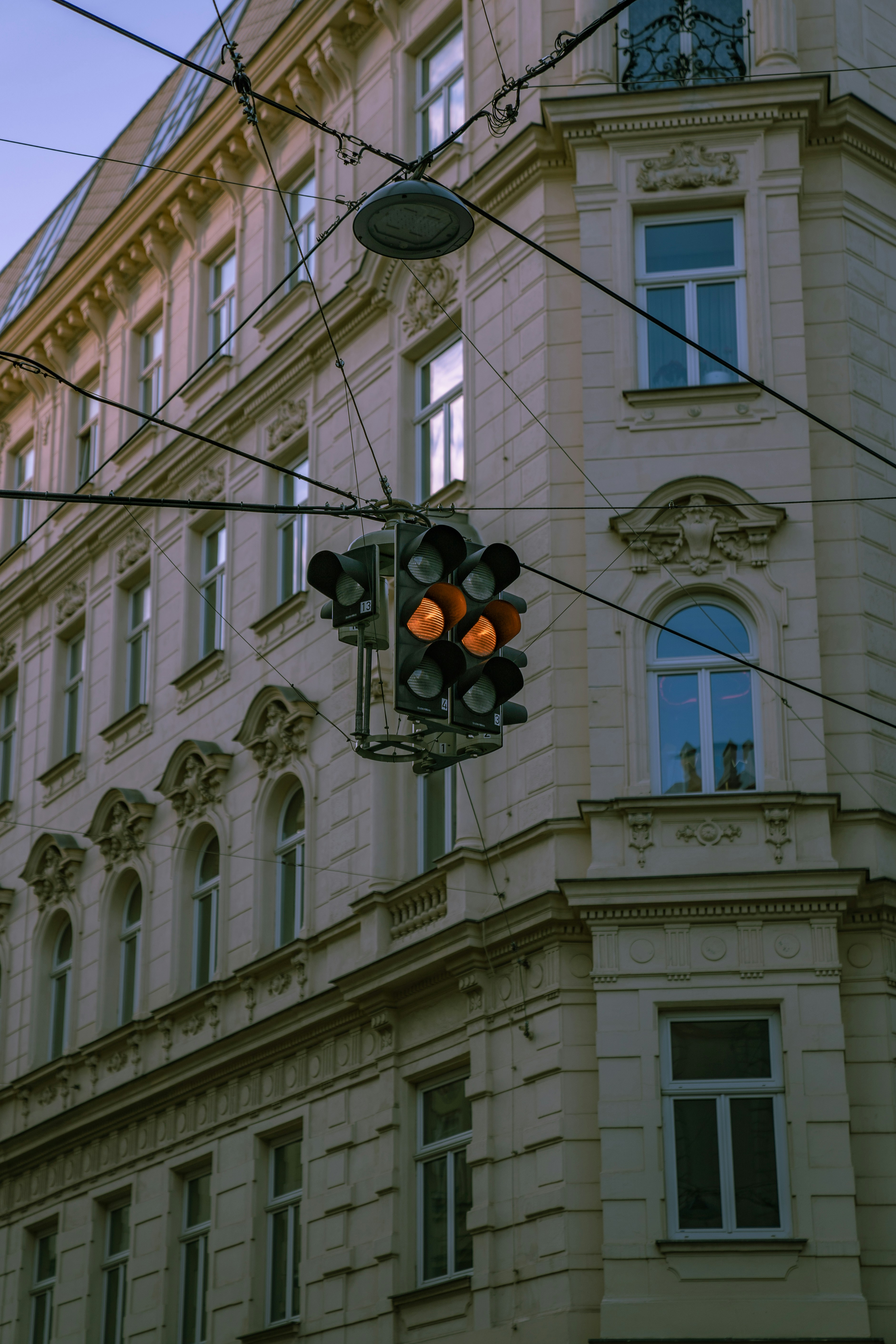 a traffic light hanging from the side of a building