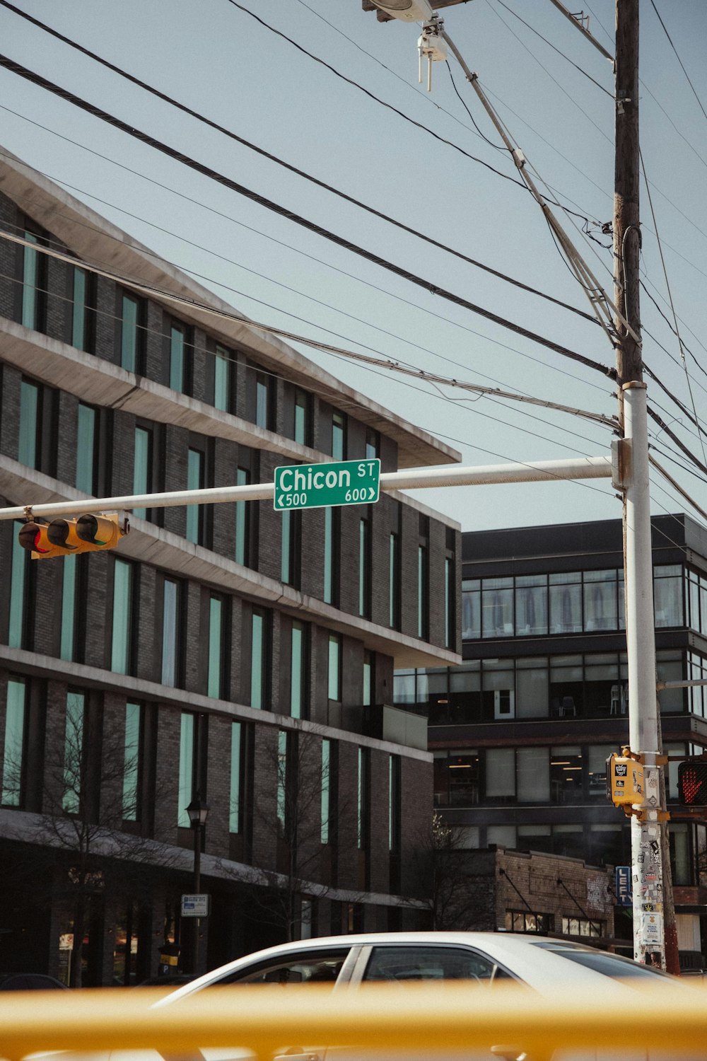 a street sign on a pole in front of a building