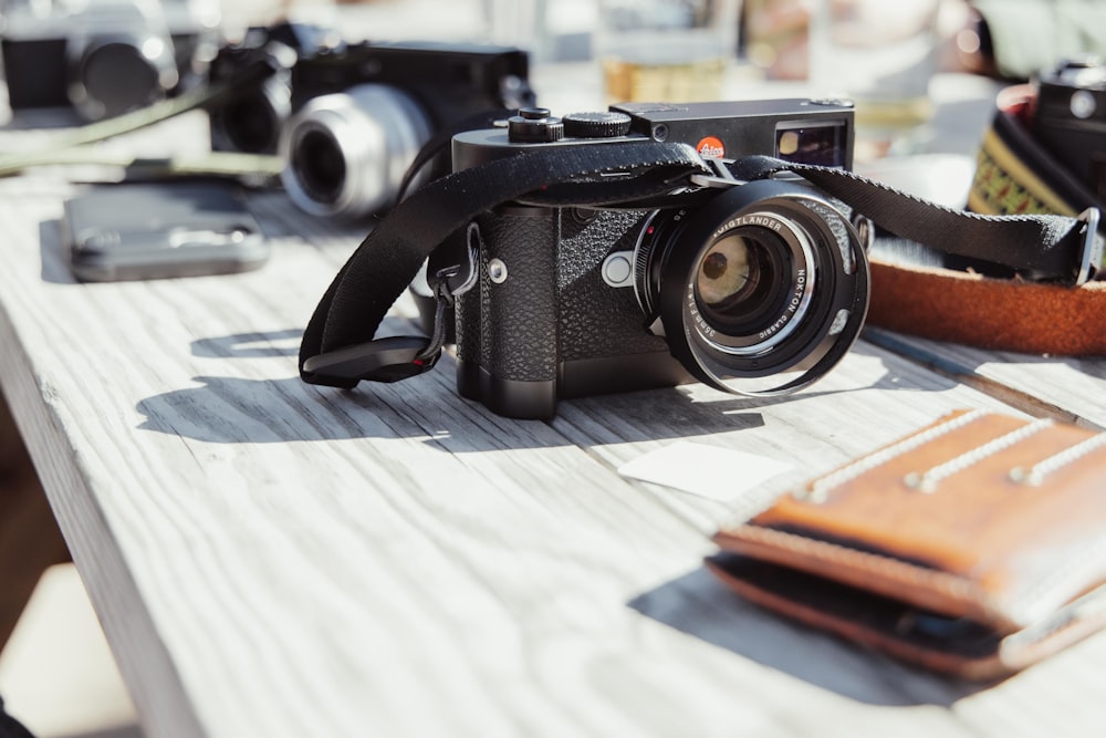 a camera sitting on top of a wooden table