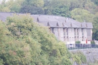 A newly built townhouse complex with wood accents and landscaped surroundings.