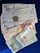 A collection of Colombian banknotes and coins is displayed on a dark blue surface. The notes are of different denominations, including 50,000, 10,000, and 2,000 pesos. Each note features distinct artwork and portraits. Two coins are visible, one silver and one gold in color.