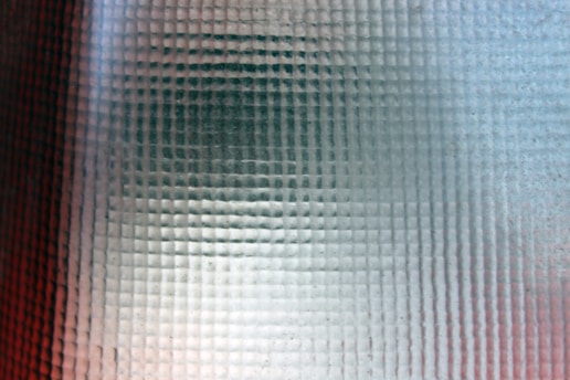 Frosted glass overlay with digital data streams and magnifying glass icons.