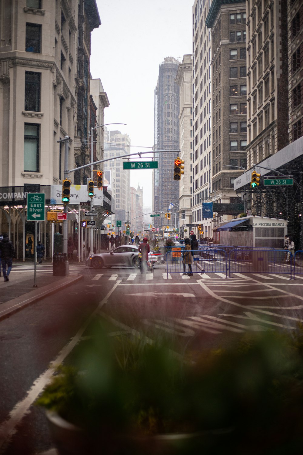 a city street filled with lots of tall buildings