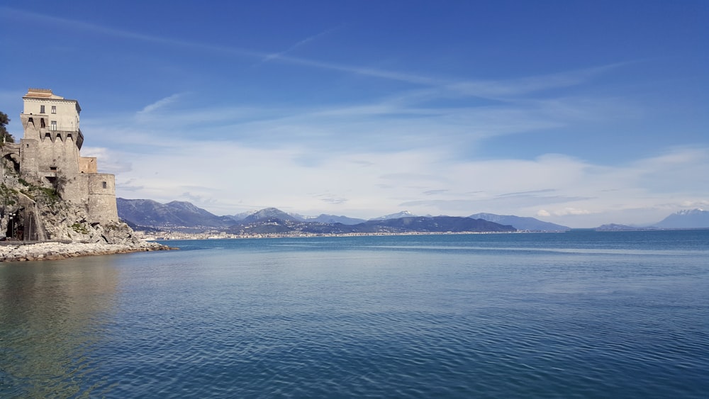 a large body of water with a castle on top of it