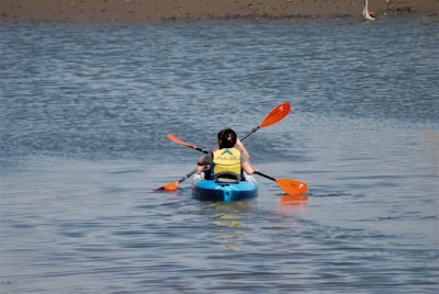 a person in a kayak on a body of water