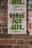 A weathered protest poster on a brick wall with the text 'REBEL FOR LIFE' in bold, green letters. The poster includes references to 'extinction rebellion' and details a date and location as '23 August London'. The background comprises rustic red and brown bricks, partly covered by remnants of other posters.