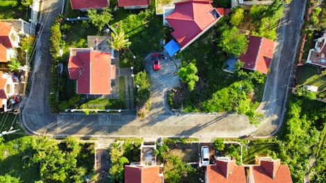 an aerial view of a neighborhood with houses and trees