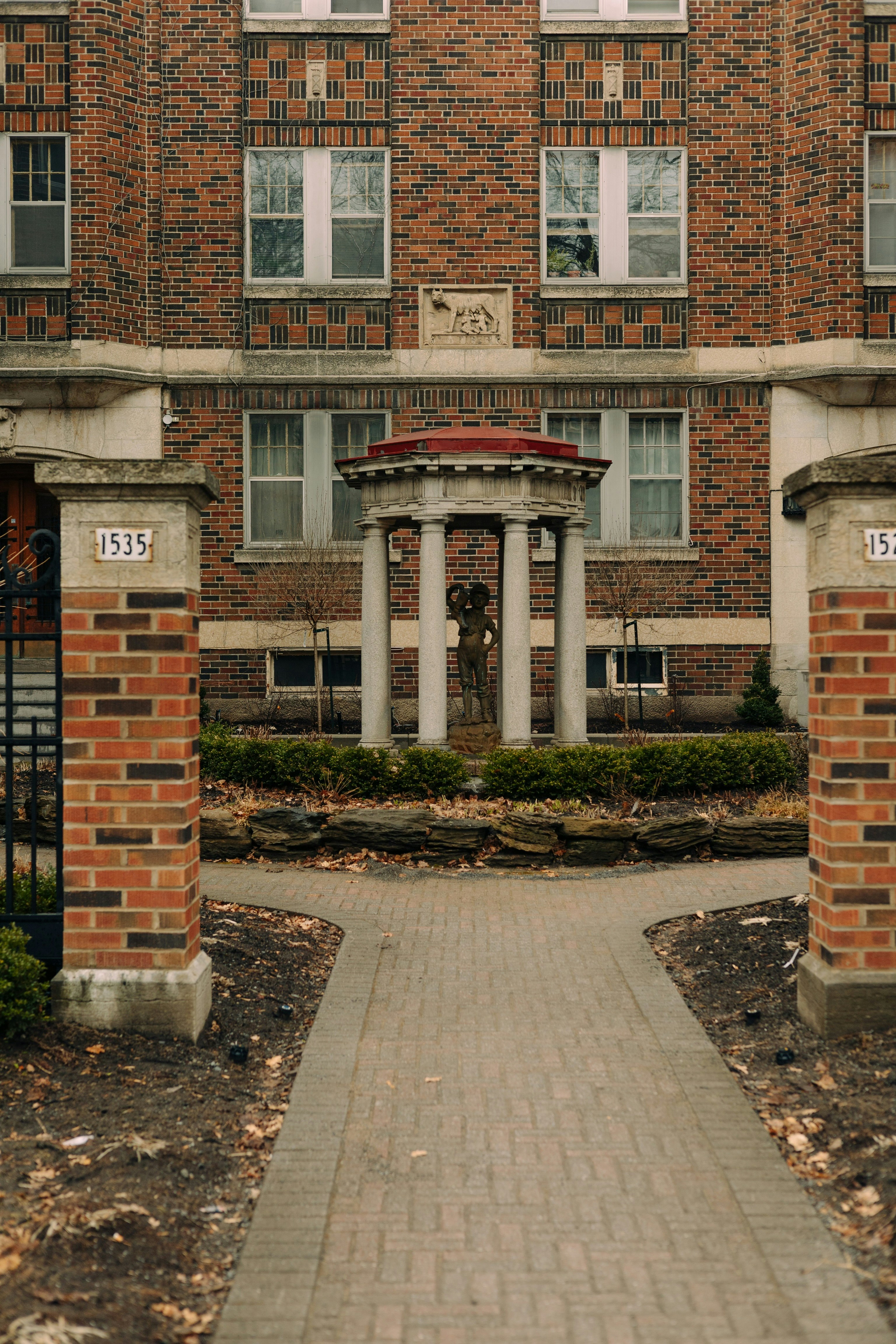 a brick building with a clock on the front of it