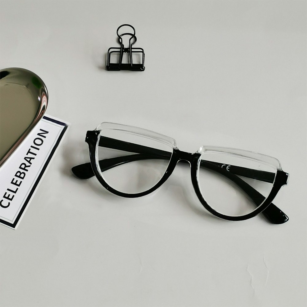 a pair of glasses sitting on top of a table